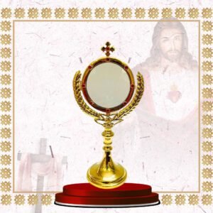 gold monstrance with wheat design and red stone accents